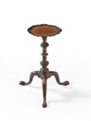 A George III mahogany 'pie crust' candle stand