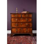 A George II walnut chest of drawers