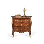 ϒ A rosewood, marquetry and gilt metal mounted serpentine commode