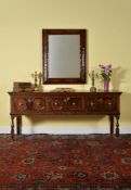 A Charles II oak dresser base