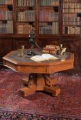 A Gothic revival oak drum library table