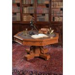 A Gothic revival oak drum library table