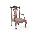 A George II carved walnut armchair