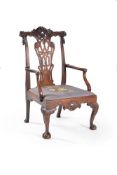 A George II carved walnut armchair