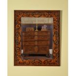 A William & Mary walnut, ebonised and marquetry decorated wall mirror