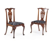 A set of twelve mahogany dining chairs