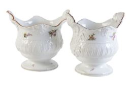 A pair of Meissen small wine bottle coolers