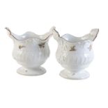 A pair of Meissen small wine bottle coolers