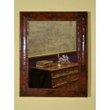 A William & Mary olivewood and walnut oyster veneered wall mirror