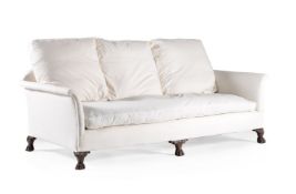 A carved walnut and upholstered sofa