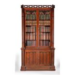 A George IV mahogany and plum pudding mahogany cabinet bookcase