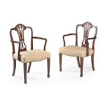 A pair of George III mahogany armchairs