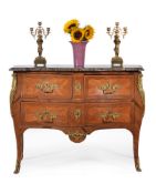 ϒ A Louis XV tulipwood and palisander serpentine commode