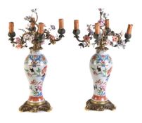 A pair of French famille rose gilt-metal-mounted four-light baluster flower-encusted lamps of Edme S