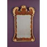 A George II walnut and parcel gilt wall mirror