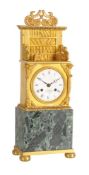 A French Louis Philippe ormolu and green marble mantel clock