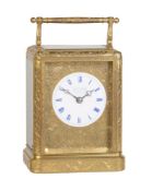 A fine and rare French engraved gilt brass carriage clock with two-plane 'chaffcutter' escapement