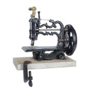 A cast iron ‘Weir’s 55/-’ small chain stitch sewing machine