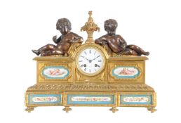 A French Napoleon III Sevres style porcelain inset ormolu and patinated bronze mantel clock