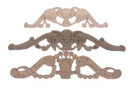 Two carved walnut longcase clock pediment crest ornaments