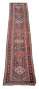 A Qashqai West Persian runner, the indigo field with stylised birds, flowering plant and floral