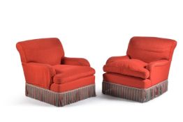 A pair of red upholstered armchairs, late 20th century, after the manner of Howard & Sons, each with