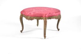 A Louis XVI style green painted and parcel gilt shaped circular stool, late 19th century, the red