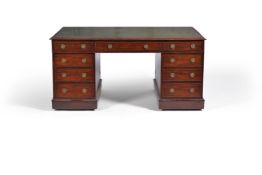 A Victorian mahogany partners pedestal desk, mid 19th century, the moulded rectangular top with a