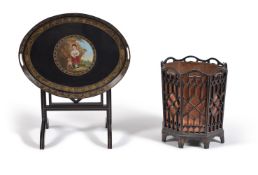 An ebonised and parcel gilt jardinière, early 20th century, the octagonal body with pierced fretwork