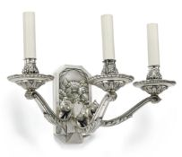 A pair of silver coloured metal three light wall appliques in Art Deco style, 20th century, the