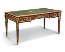 A French ormolu- mounted mahogany bureau plat, late 19th/ early 20th century, with eared rectangular