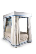 A mahogany tester bed, part 18th century, the blue and white chintz tester with conforming hangings,