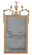 A Continental giltwood and composition wall mirror, late 18th/early 19th century, 108cm high, 56cm