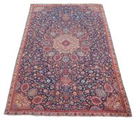 A Tabriz carpet of Ardabil design, the navy field decorated profusely with meandering floral