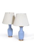 A pair of Continental blue-ground vases, of tapering form with trumpet necks, the inside rim with