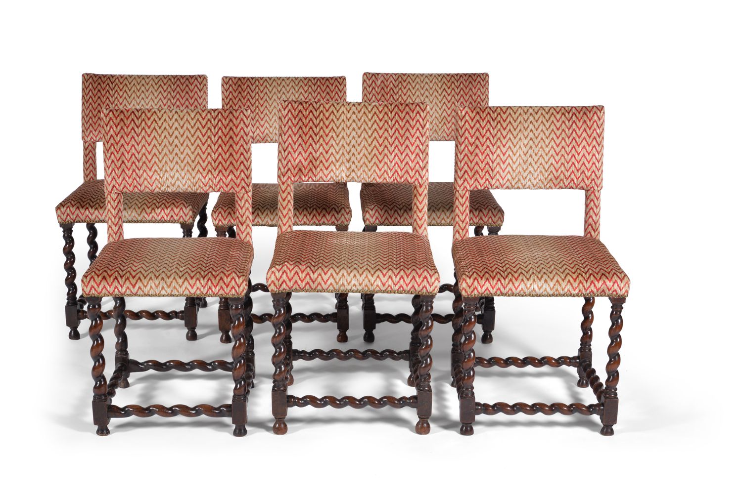 A harlequin set of eight walnut dining chairs, circa 1665, to include two armchairs, each with