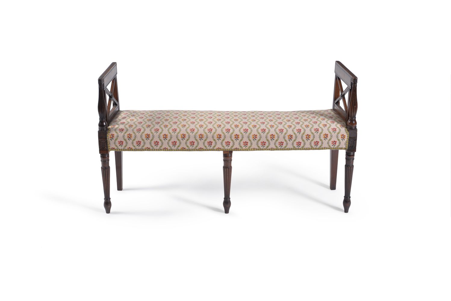 An unusual Regency mahogany window seat, circa 1815, the angled rectangular sides with x-shaped