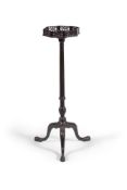 A mahogany torchere stand in George III style, 19th century, the octagonal top with fretwork