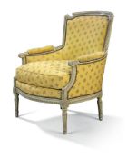 A Louis XVI grey-painted bergere, with curved arched tapering padded back and cushion seat on fluted