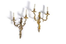 A pair of gilt bronze twin light wall appliques in Louis XV taste, early 20th century, in the manner