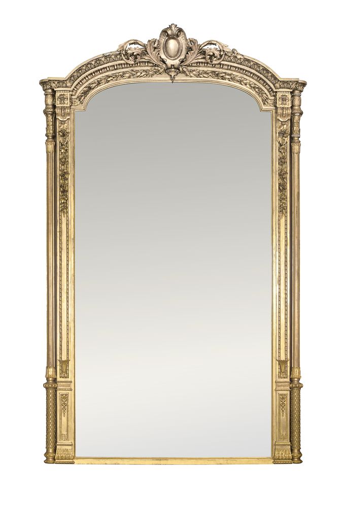 A French large gilt-gesso pier mirror, 19th century, the arched cresting centred by a cabochon,