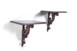 A pair of George III style carved mahogany small console brackets, 20th century, the moulded