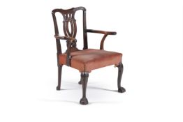 An early George III mahogany armchair, circa 1760, in the manner of Linnell the yoke back with