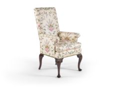 A George II mahogany armchair, mid-18th century, the rectangular padded back, arms and padded seat