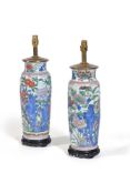 A pair of Chinese ‘Wucai’ sleeve vases, in 17th century style, of tapering cylindrical form with