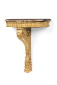 A carved giltwood console table, late 19th century, the moulded, shaped rouge royale marble top