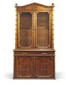 A Napoleon III pine and simulated bamboo display cabinet, third quarter 19th century, the arched