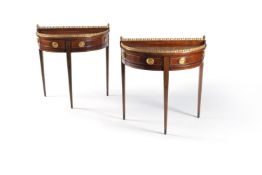 A pair of Dutch mahogany and brass-inlaid semi-circular side tables, early 19th century, the tops