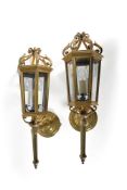A pair of gilt metal and glazed hexagonal wall lanterns in George III taste, second half 20th