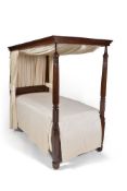 An 18th/19th century composite mahogany poster bed, with two tapered spiral and fluted posted with